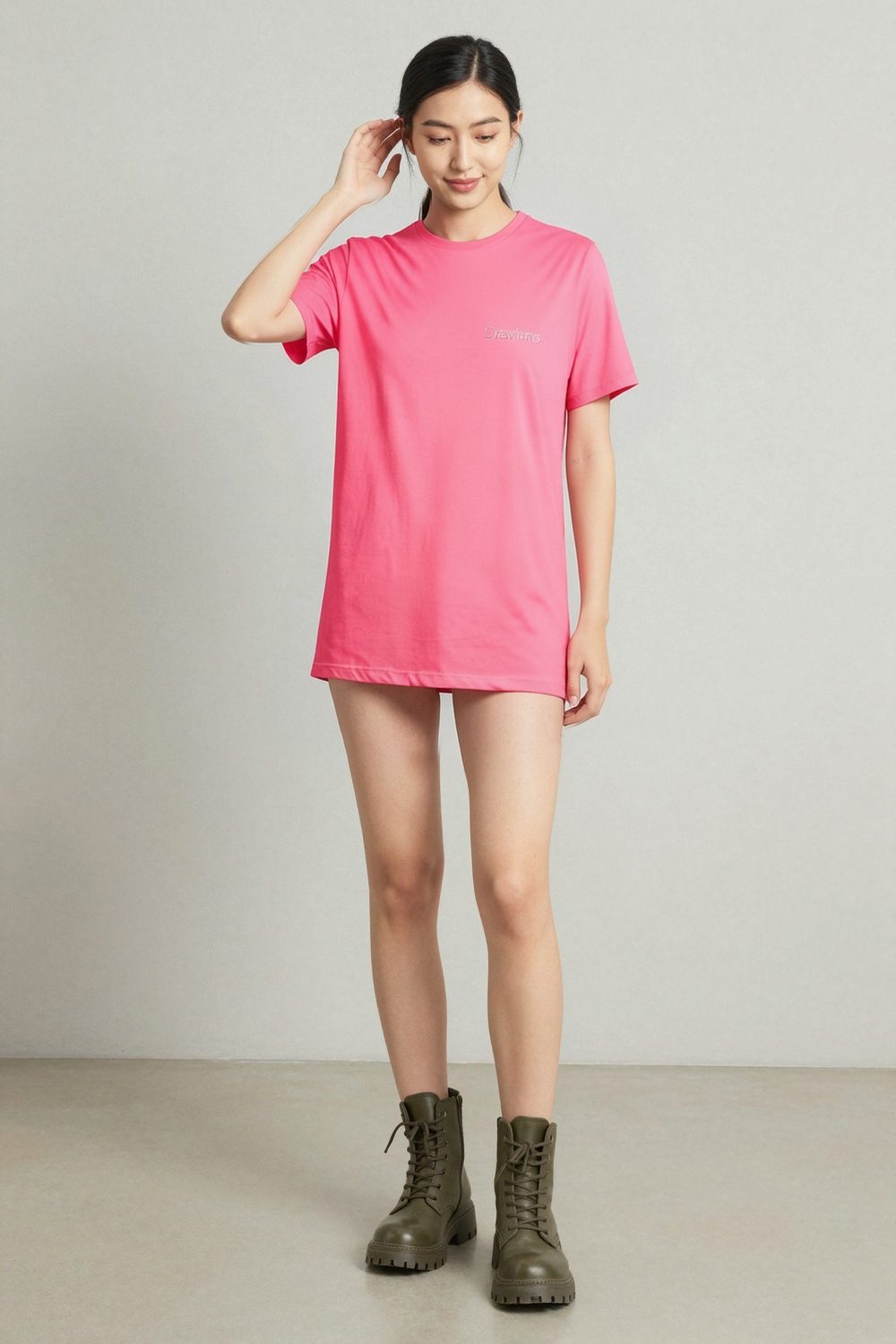 pink t-shirt on female model in rooftop evening setting professional fashion photography