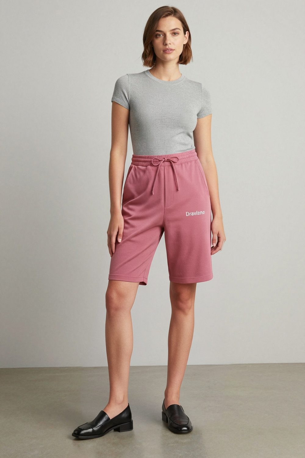 maroon joggers on female model in studio white setting professional fashion photography