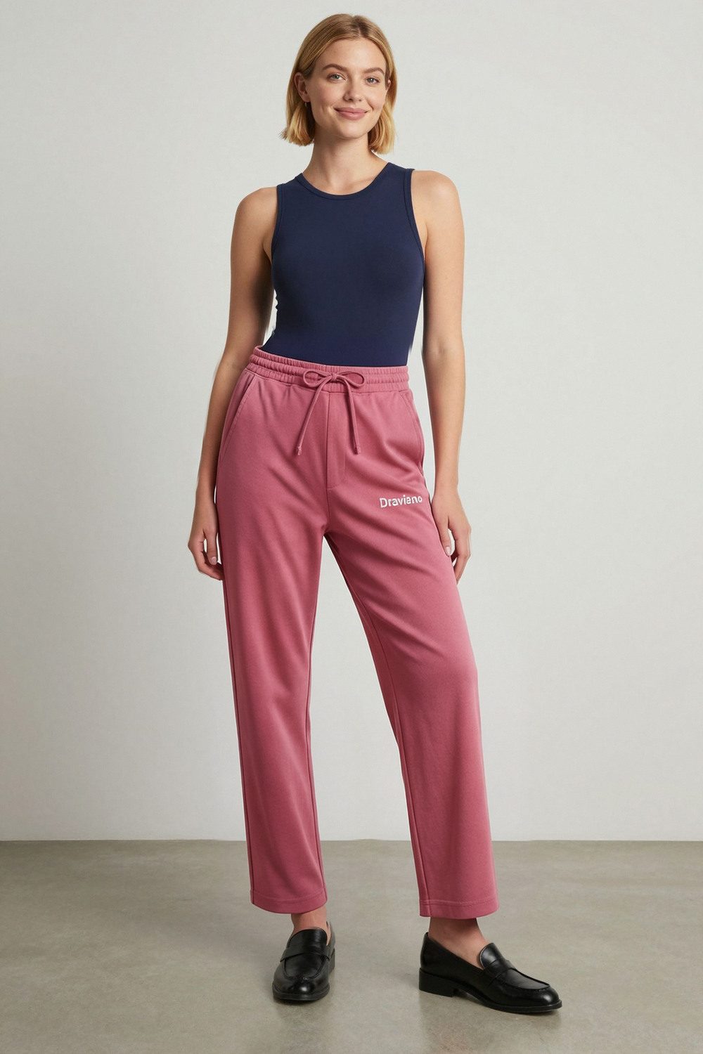maroon joggers on female model in rooftop evening setting professional fashion photography