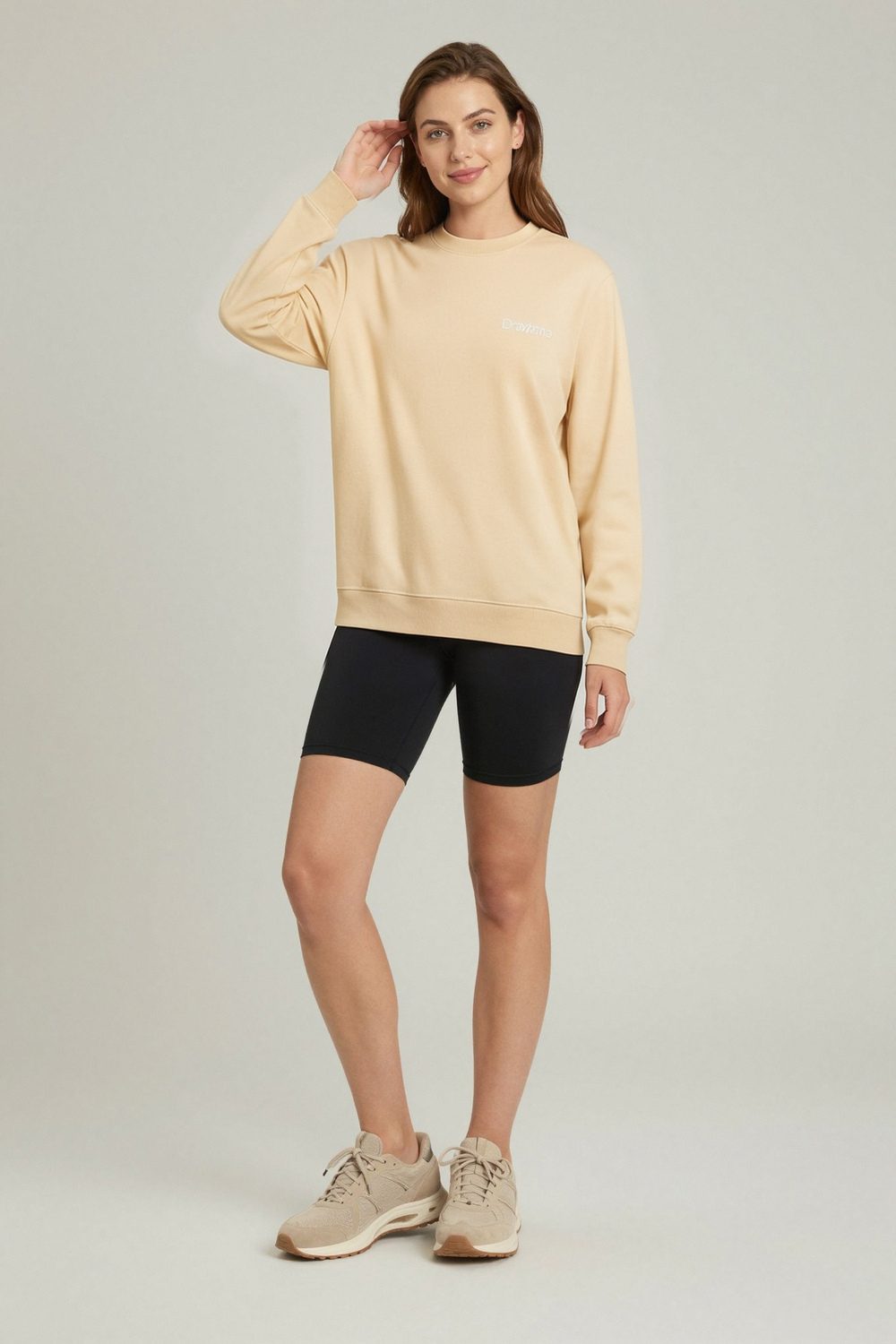 sandshell sweatshirt on female model in beach sunset setting professional fashion photography