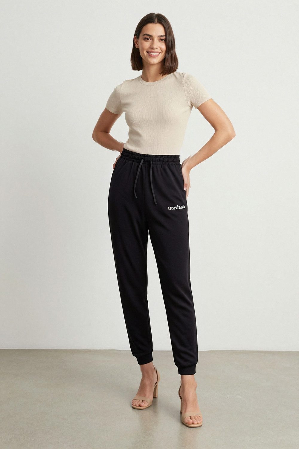 black joggers on female model in studio white setting professional fashion photography