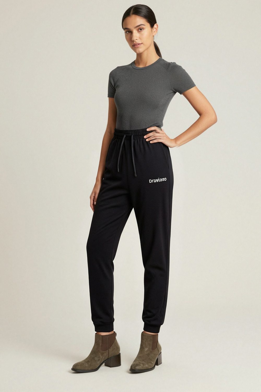 black joggers on female model in studio neutral setting professional fashion photography