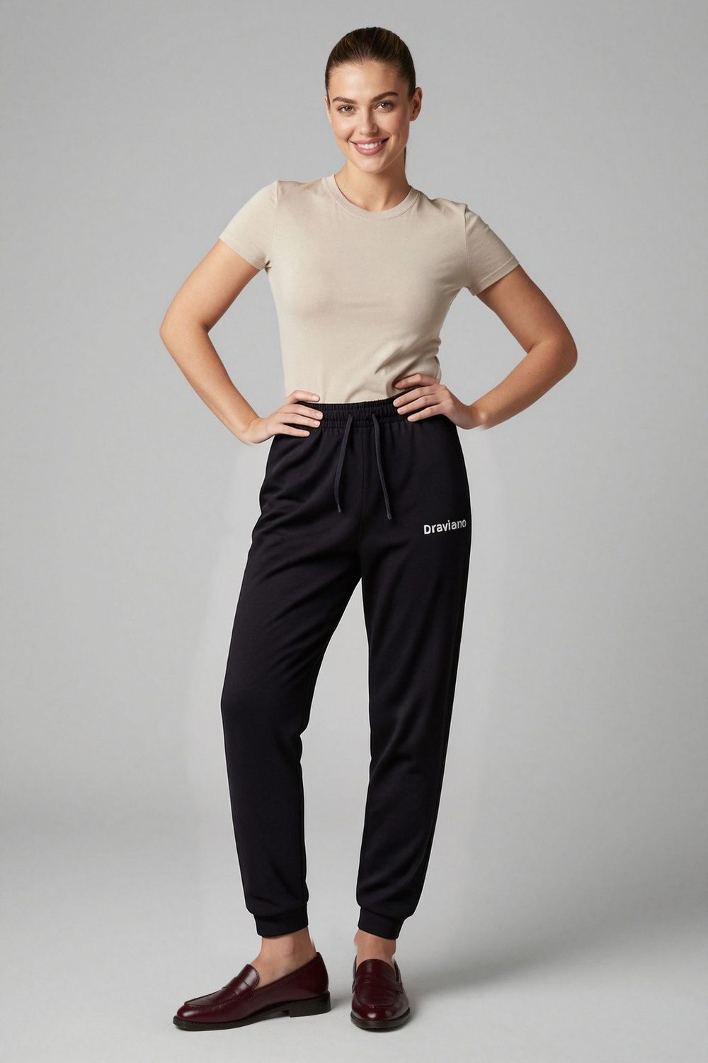 black joggers on female model in rooftop evening setting professional fashion photography
