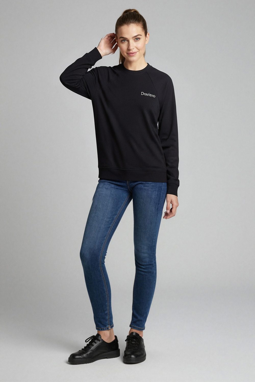 black sweatshirt on female model in coastal scenic setting professional fashion photography