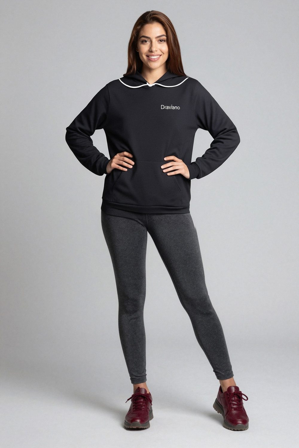 black hoodie on female model in studio white setting professional fashion photography