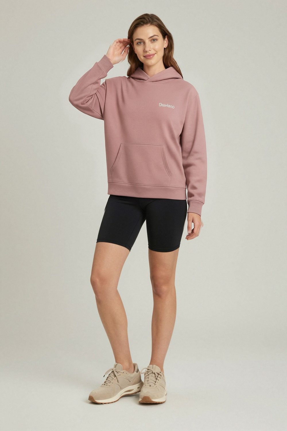 unknown hoodie on female model in desert adventure setting professional fashion photography