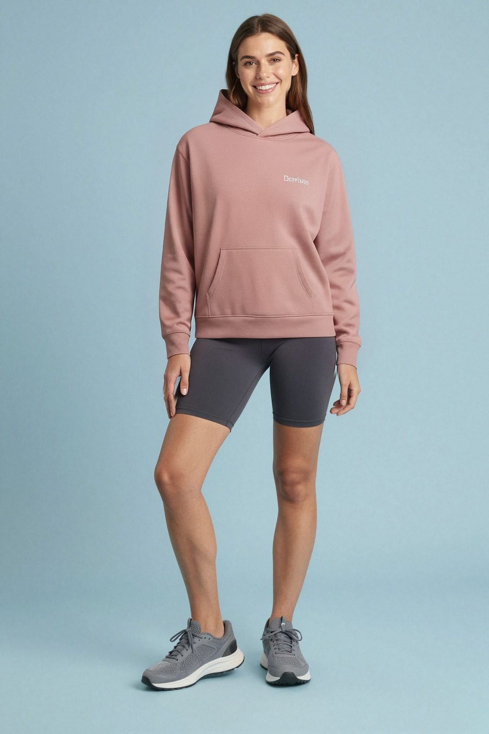 charcoal grey hoodie on female model in studio neutral setting professional fashion photography
