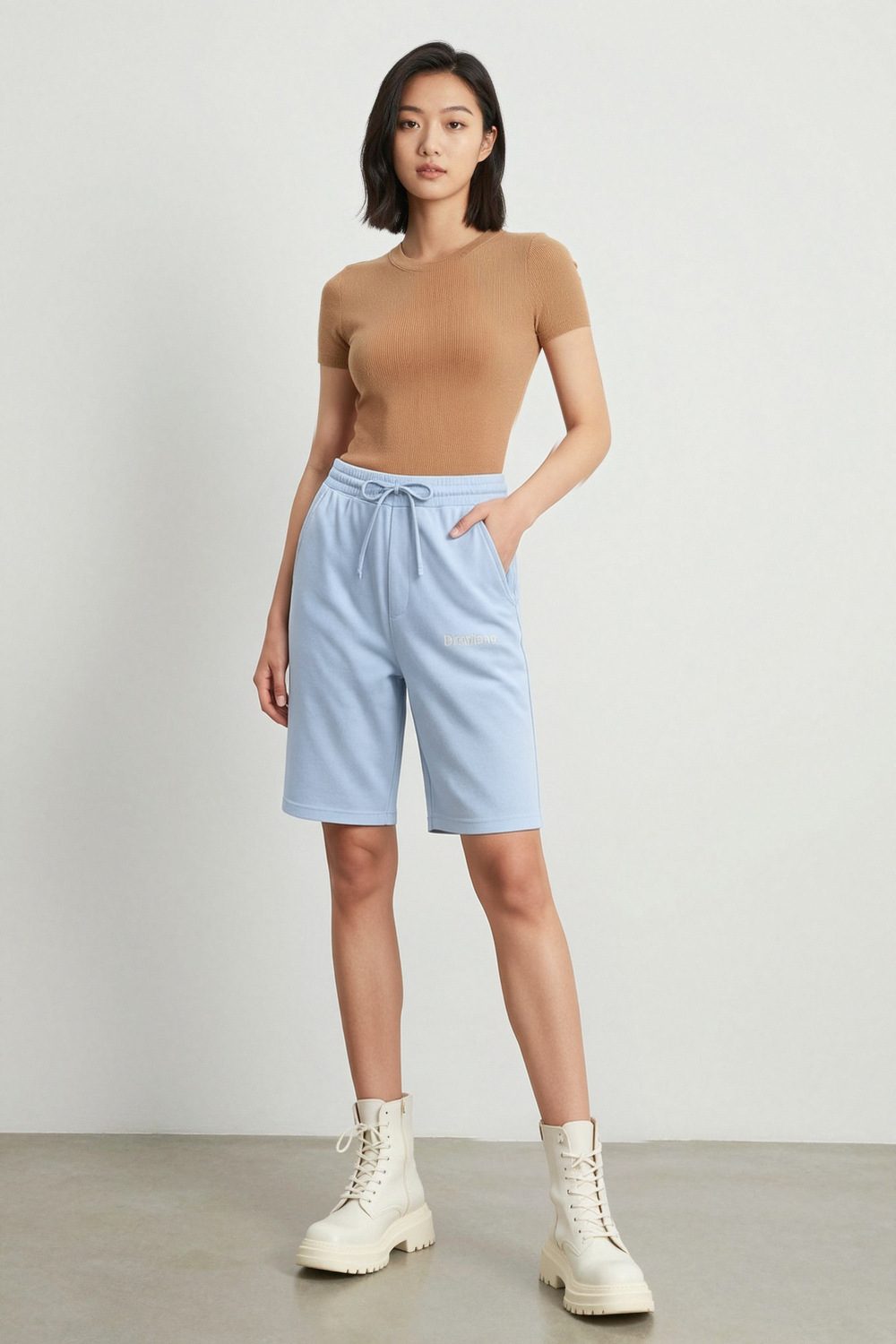 light blue joggers on female model in coastal scenic setting professional fashion photography