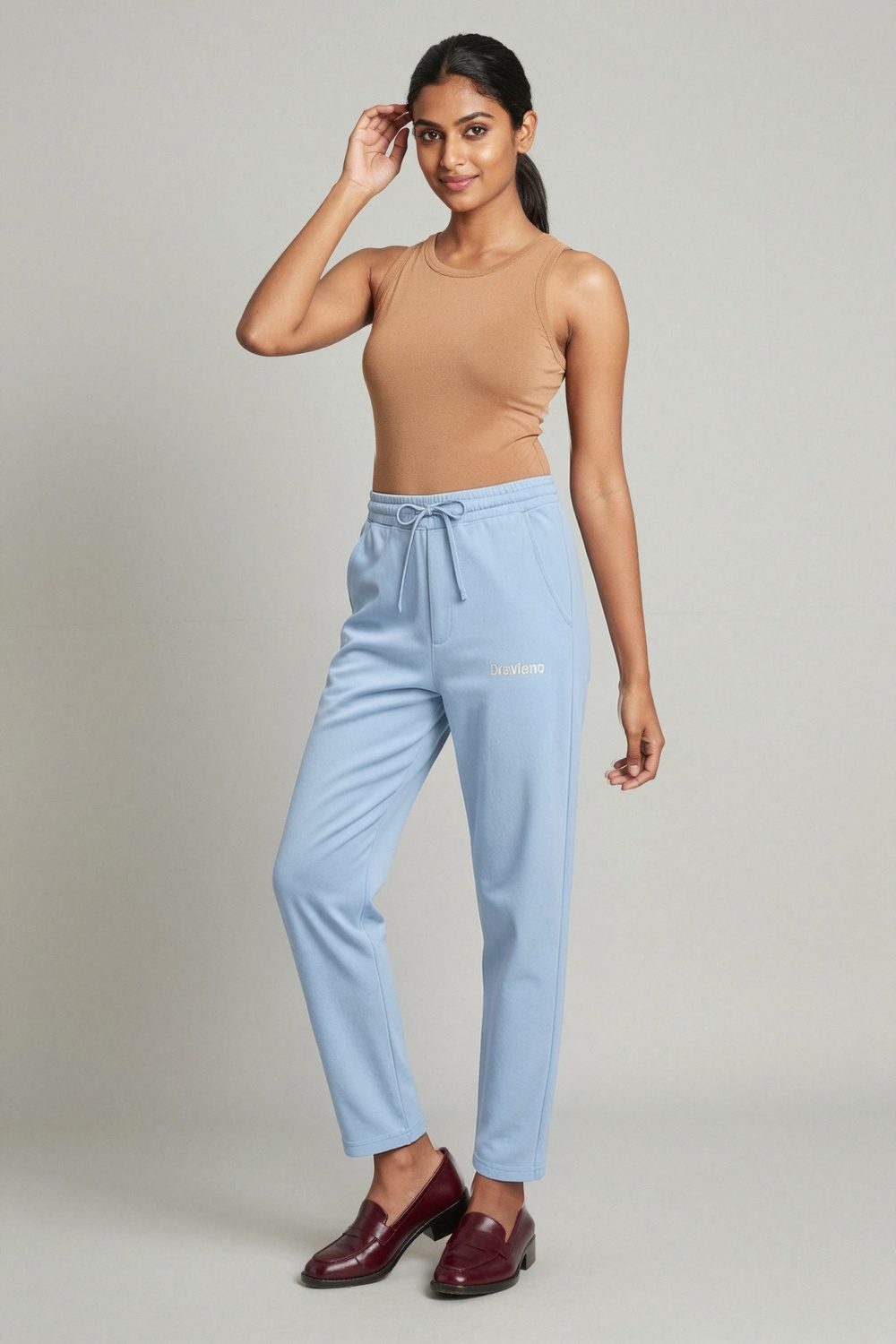 light blue joggers on female model in desert adventure setting professional fashion photography