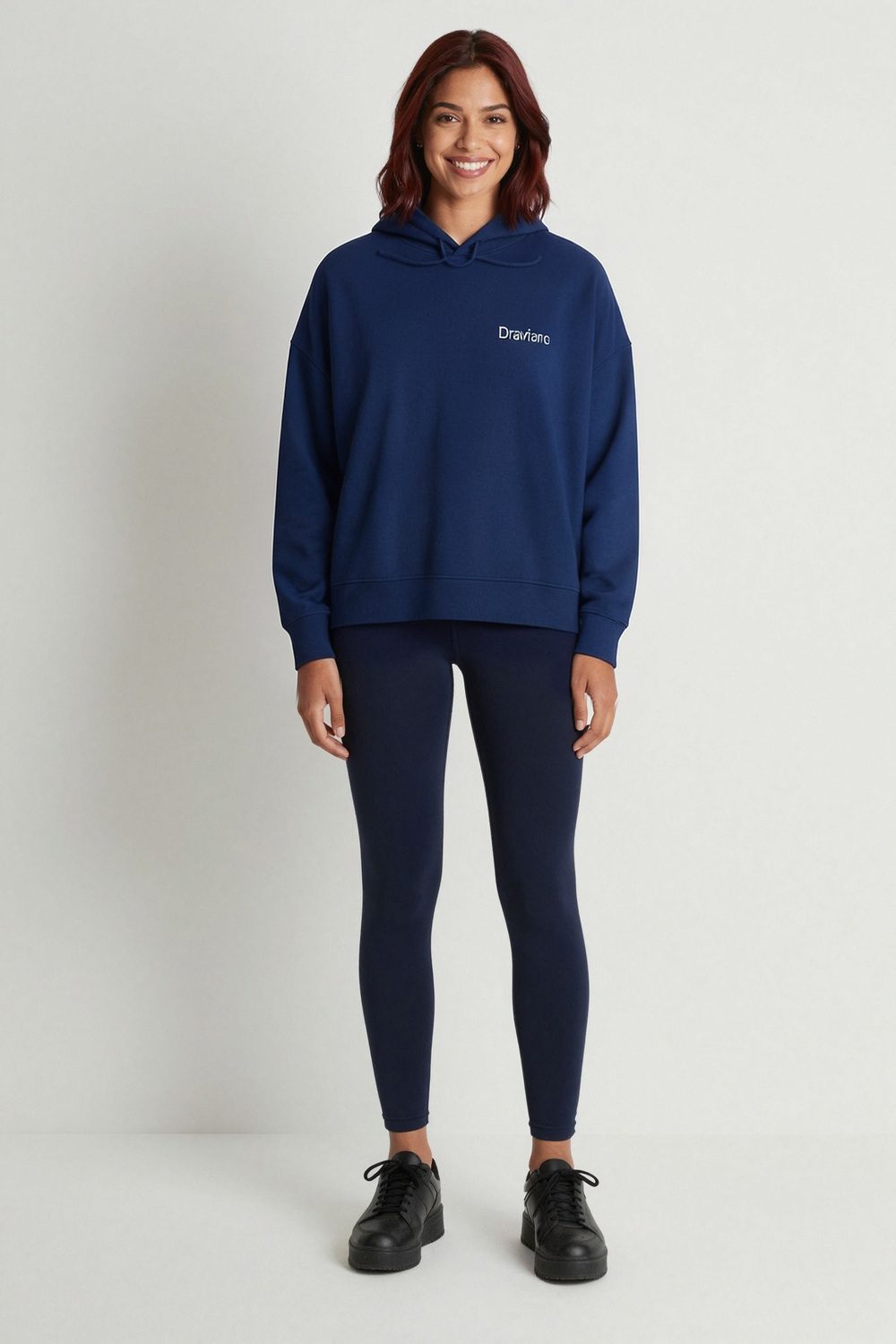 not specified hoodie on female model in coastal scenic setting professional fashion photography