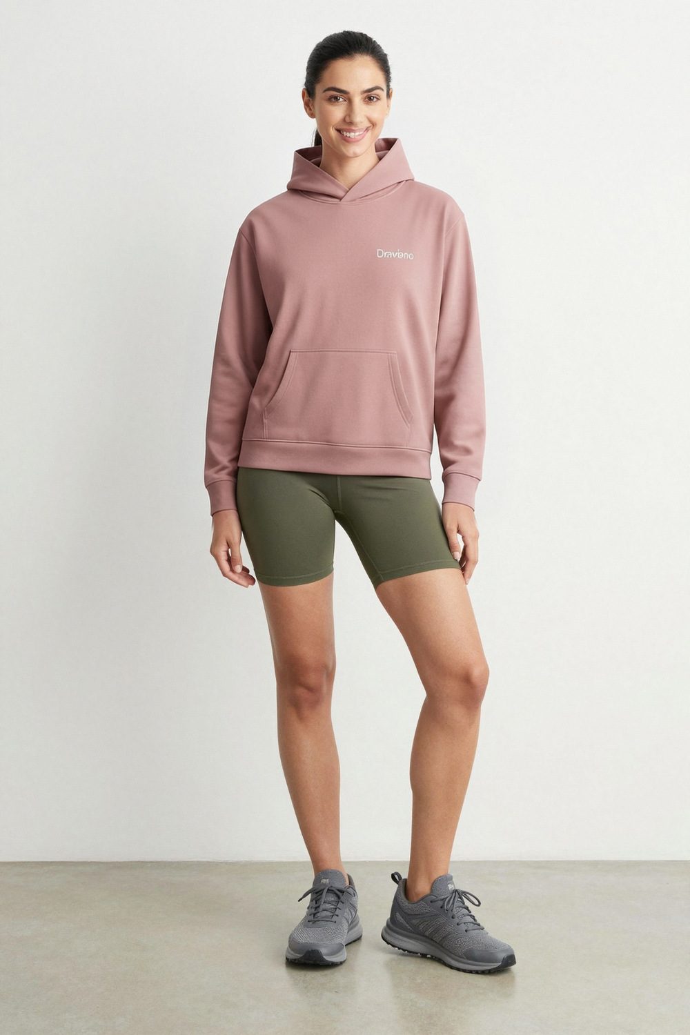 unknown hoodie on female model in rooftop evening setting professional fashion photography