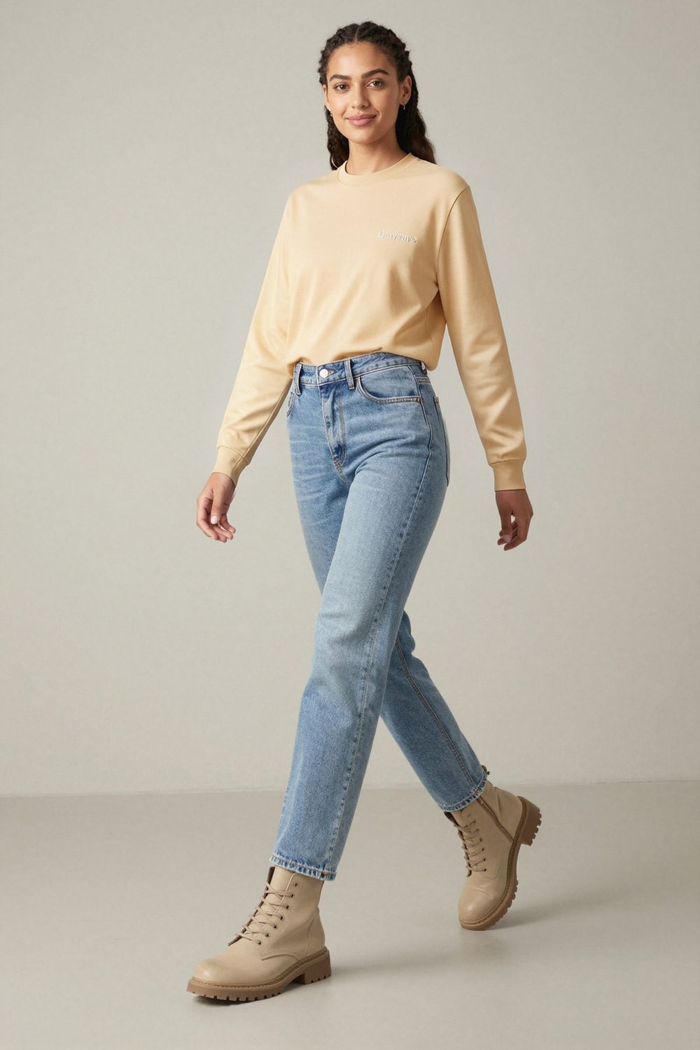 sandshell sweatshirt on female model in studio neutral setting professional fashion photography
